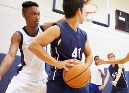 Middle school boys playing basketball.